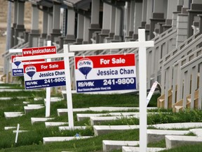 Real estate sales are down from last year. These signs are in various northeast communities.
