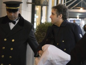 Michael Cohen arrives at his home Thursday, Jan. 18, 2019 in New York. Democrats are vowing to investigate whether President Donald Trump directed Cohen, his personal attorney, to lie to Congress about a Moscow real estate project, calling that possibility a "concern of the greatest magnitude." (AP Photo/Kevin Hagen)