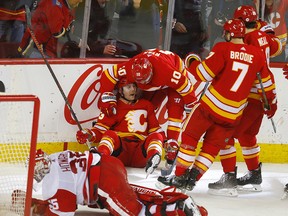 Calgary Flames celebrate a goal against the Detroit Red Wings at the Saddledome on Friday, Jan. 18, 2019.