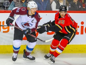 Colorado Avalanche Gabriel Landeskog battles against Noah Hanifin of the Calgary Flames during NHL hockey at the Scotiabank Saddledome in Calgary on Thursday, November 1, 2018.