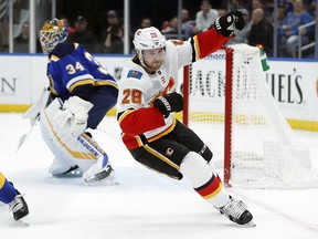 Calgary Flames Elias Lindholm scores on St. Louis Blues goaltender Jake Allen on Dec. 16, 2018, in St. Louis.