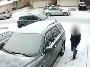 Still image from video released by Calgary Police Service, showing a car being stolen in Calgary.