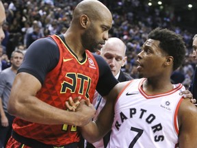 Toronto Raptors guard Kyle Lowry (7) and Atlanta Hawks forward Vince Carter (15) in Toronto, Ont. on Tuesday January 8, 2019. The Toronto Raptors host the Atlanta Hawks. Veronica Henri/Toronto Sun/Postmedia Network