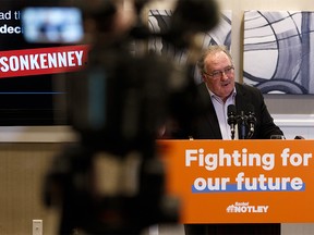 Brian Mason, MLA for Edmonton-Highlands-Norwood and Minister of Transportation, unveils a website called TheTruthAboutJasonKenney.ca during a press conference in Edmonton, on Thursday, Feb. 14, 2019. Photo by Ian Kucerak/Postmedia