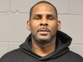 In this photo taken and released by the Chicago Police Dept., Friday, Feb. 22, 2019, R&B singer R. Kelly is photographed during booking at a police station in Chicago. (Chicago Police Dept. via AP)