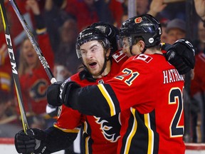 Calgary Flames Andrew Mangiapane, left, celebrates his goal on Anaheim Ducks with teammate Garnet Hathaway in NHL hockey action at the Scotiabank Saddledome in Calgary, Alta. on Friday February 22, 2019. Leah Hennel/Postmedia