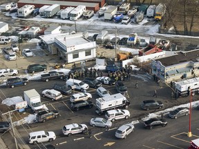 First responders and emergency vehicles are gathered near the scene of a shooting at an industrial park in Aurora, Ill., on Friday, Feb. 15, 2019. (Bev Horne/Daily Herald via AP) ORG XMIT: ILARL202