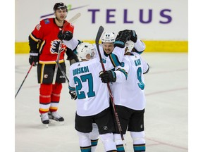 San Jose Sharks Evander Kane celebrates after scoring on Mike Smith of the Calgary Flames in NHL hockey at the Scotiabank Saddledome in Calgary on Thursday. Photo by Al Charest/Postmedia.