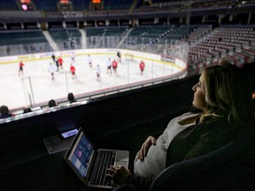 Postmedia sports reporter Kristen Anderson watches Calgary Flames practice at the Saddledome in Calgary, on Thursday Dec. 6, 2018.