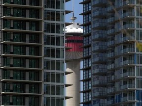 The Calgary Tower hidden behind construction of condo towers.