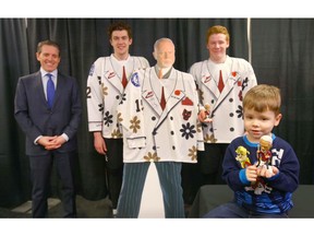 William Osler (L) kidney foundation board member, joins Calgary Hitmen players Devan Klassen and Dakota Krebs along with Markus Wilson as they pose with a Don Cherry cutout, bobblehead and themed jersey during a press conference in Calgary on Thursday, February 28, 2019. Markus is awaiting a kidney transplant The Hitmen will be wearing the specially designed jersey on Sunday to promote awareness for organ donation. Cherry's son received a kidney transplant from his sister Cindy. Jim Wells/Postmedia