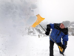 Darryl Sankey like most Calgarians was busy clearing snow as the city recieved another dump of the white stuff with cold temperatures on Saturday February 16, 2019. Darren Makowichuk/Postmedia