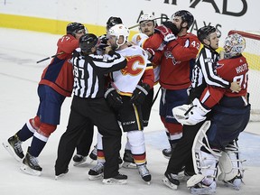 The Washington Capitals and the Calgary Flames scuffle after the end of the game on Friday, Feb. 1, 2019, in Washington.