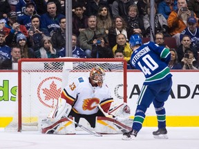 Vancouver Canucks' Elias Pettersson scores against Calgary Flames goalie David Rittich in the shootout in Vancouver on Saturday, Feb. 9, 2019.