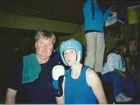 Kandi Wyatt at age 15, when she won her second national championship. She is pictured with coach Mike Smith.