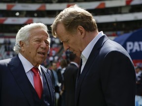 In this Nov. 19, 2017, file photo, NFL Commissioner Roger Goodell, right, talks with New England Patriots owner Robert Kraft before the Patriots face the Oakland Raiders in Mexico City.