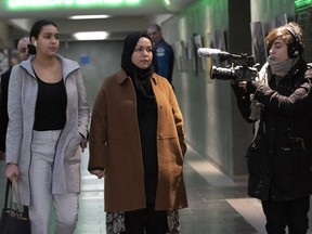 Members of the Muslim community arrive to hear the judge's sentencing for Alexandre Bissonnette, who pleaded guilty after killing six people in a mosque shooting in 2017, on Friday, Feb. 8, 2019, at the courthouse in Quebec City.