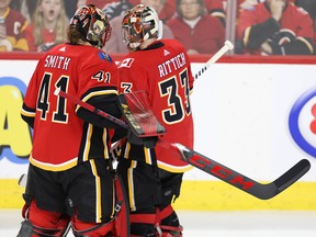 Calgary Flames goaltender Mike Smith replaces David Rittich during a game against the San Jose Sharks at the Scotiabank Saddledome in Calgary on Thursday, Feb. 7, 2019.
