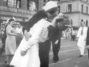 In this Aug. 14, 1945 file photo provided by the U.S. Navy, a sailor and a woman kiss in New York's Times Square, as people celebrate the end of the Second World War. (/)
