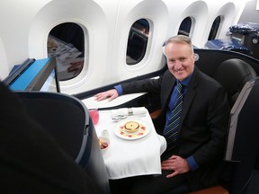 Westjet president and CEO Ed Sims sits in one of the business class pods on the company's first Boeing 787 Dreamliner on Thursday, Feb. 14, 2019.
