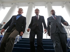 In this Jan. 12, 2018 file photo, Virginia Gov.-elect, Lt. Gov Ralph Northam, centre, walks down the reviewing stand with Lt. Gov-elect, Justin Fairfax, right, and Attorney General Mark Herring at the Capitol in Richmond, Va. The political crisis in Virginia exploded Wednesday, Feb. 6, 2019, when the state's attorney general confessed to putting on blackface in the 1980s and a woman went public with detailed allegations of sexual assault against the lieutenant governor. With Northam's career already hanging by a thread over a racist photo, the day's developments threatened to take down all three of Virginia's top elected officials.