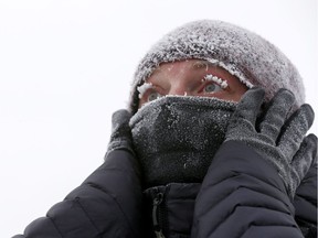 Karl Willrich was feeling the cold during his walk in Crescent Heights as the deep freeze hit Calgary on Sunday February 3, 2019. Darren Makowichuk/Postmedia