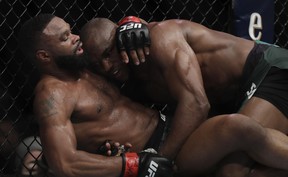 Tyron Woodley (L) and Kamaru Usman, of Nigeria, grapple during their welterweight title bout during UFC 235 at T-Mobile Arena on March 2, 2019 in Las Vegas.