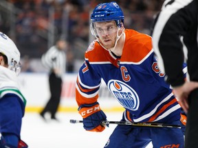 Edmonton Oilers' Connor McDavid (97) faces off in the game versus the Vancouver Canucks during the first period of NHL action at Rogers Place in Edmonton, on Thursday, March 7, 2019.