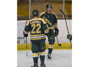 University of Alberta Golden Bears Luke Philp celebrates A goal with teammate Ben Carroll against the University of Calgary Dinos during a game last season. Postmedia file photo.