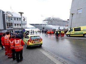 The cruise ship Viking Sky, that ran into trouble in stormy seas off Norway, reaches the port of Molde under its own steam on March 24, 2019. - Escorted by tugboats, the Viking Sky arrived at the port of Molde. Nearly a third of its 1,373 passengers and crew had already been airlifted off the ship after it lost power along a stretch of Norwegian coastline notorious for shipwrecks. (Photo by Svein Ove EKORNESVAAG / NTB scanpix / AFP) / Norway OUTSVEIN OVE EKORNESVAAG/AFP/Getty Images