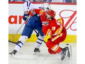 Toronto Maple Leafs Nikita Zaitsev collides with Matthew Tkachuk of the Calgary Flames during NHL hockey at the Scotiabank Saddledome in Calgary on Monday, March 4, 2019. Al Charest/Postmedia