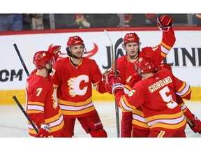 The Calgary Flames' Matthew Tkachuk celebrates with teammates after scoring against the New York Rangers in NHL hockey at the Scotiabank Saddledome in Calgary on Friday, March 15, 2019. Al Charest/Postmedia