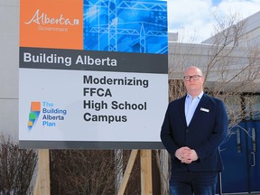 Jeff Wilson, board chair with the Foundations for the Future Academy, stands next to a government funding sign that has stood in front of the academy's high school in Montgomery since 2014. The school is filled with serious structural failures that have yet to be repaired. Wilson was photographed at the school on Thursday February 28, 2019. Gavin Young/Postmedia