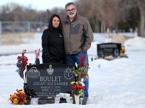 Logan Boulet's parents Bernadine and Toby stand at their son's grave in Lethbridge on Wednesday March 13, 2019. The couple are honouring Logan's life by helping organizations to promote organ donor registrations. Logan's organ donations created a huge rise in organ donation registration across Canada which has become known as the Logan Boulet effect. Green shirt day on April 7, the day Logan died and helped six others, will raise awareness for organ donations. Gavin Young/Postmedia