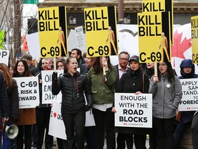 Pro pipeline supporters rally across the street from the Fairmont Palliser Hotel in Calgary where Federal Finance Minister Bill Morneau was speaking to the Economic Club of Canada on Monday March 25, 2019. Gavin Young/Postmedia