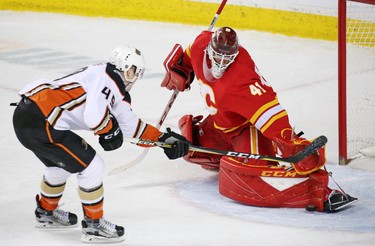 Calgary Flames goaltender Mike Smith stops this scoring chance by the Anaheim Ducks' Max Jones during NHL action in Calgary on Friday, March 29, 2019.