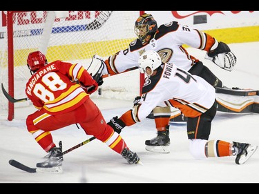 The Calgary Flames' Andrew Mangiapane narrowly missed scoring on this shot on Anaheim Ducks goaltender goalie Ryan Miller during third period NHL action in Calgary on Friday, March 29, 2019.