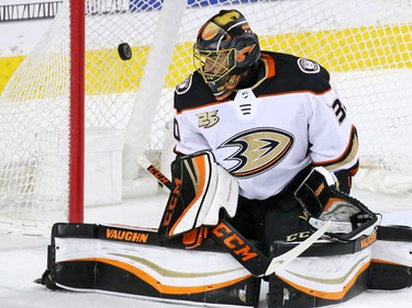 Calgary Flames captain Mark Giordano's shot goes past Anaheim Ducks goaltender goalie Ryan Miller during NHL action in Calgary on Friday, March 29, 2019.