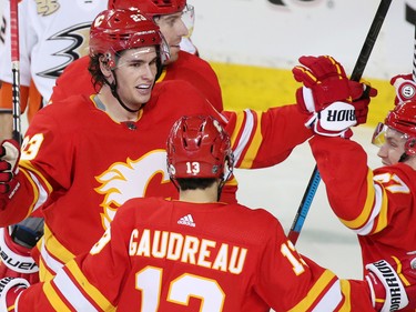 The Calgary Flames congratulate Sean Monahan after he scored his second goal on the Anaheim Ducks during NHL action in Calgary on Friday, March 29, 2019. Monahan ended up with two goals and two assists on the night.