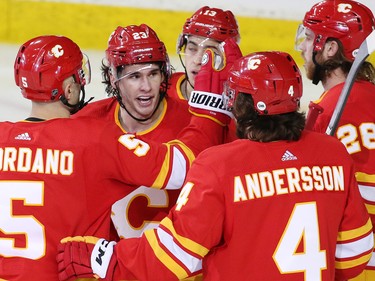 The Calgary Flames congratulate Sean Monahan after he scored on the Anaheim Ducks during NHL action in Calgary on Friday, March 29, 2019. Monahan ended up with two goals and two assists on the night.