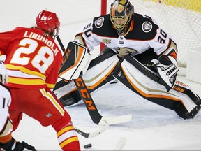 Calgary Flames forward Elias Lindholm lines up a shot on Anaheim Ducks goaltender goalie Ryan Miller during NHL action in Calgary on Friday, March 29, 2019.