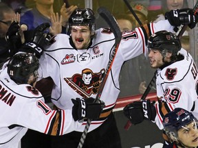 The Calgary Hitmen's Mark Kastelic celebrates after scoring on Lethbridge Hurricanes goaltender Carl Tetachuk late in the third to move the Hitmen ahead of the Hurricanes in their WHL playoff game in Calgary on Sunday, March 31, 2019. The Hurricanes went on to score in OT to stretch the series to a seventh game.