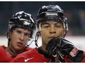 Sidney Crosby (left) and  Jarome Iginla listen to instructions from the coach during practice  on Tuesday, August 25, 2009  during Hockey Canada's National Mens Team orientation camp at the Saddledome in Calgary . (Dean Bicknell / Calgary Herald)