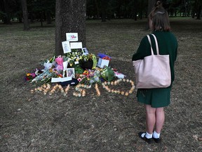 A student pays respect at a memorial site for the victims of mosque attacks in Christchurch on March 19, 2019. (WILLIAM WEST/AFP/Getty Images)