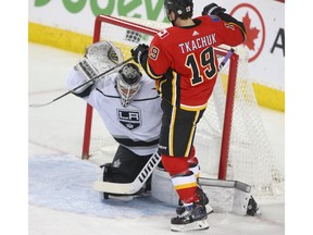 Matthew Tkachuk tries to knoch down a loose puck in front of Kings goalie Calvin Petersen during NHL action between the Los Angeles Kings and the Calgary Flames in Calgary Friday, November 30, 2018. Jim Wells/Postmedia