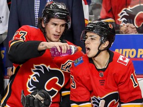 Calgary Flames Johnny Gaudreau celebrates with teammate Sean Monahan after scoring against the New Jersey Devils in NHL hockey at the Scotiabank Saddledome in Calgary on Tuesday, March 12, 2019. Al Charest/Postmedia