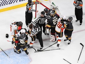 The Calgary Flames and the Vegas Golden Knights fight in the second period of their game at T-Mobile Arena on March 6, 2019 in Las Vegas, Nevada.