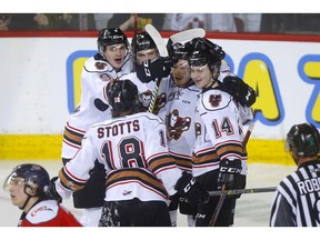 Calgary Hitmen's James Malm celebrates his goal on Lethbridge Hurricanes goalie Carl Tetachuk in second-period WHL playoff action at the Scotiabank Saddledome in Calgary on Thursday, March 28, 2019. Darren Makowichuk/Postmedia