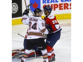 Calgary Hitmen forward Luke Coleman celebrates Vladislav Yeryomenko's goal on Lethbridge Hurricanes goalie Carl Tetachuk in third period WHL playoff action at the Scotiabank Saddledome in Calgary on Thursday, March 28, 2019. Darren Makowichuk/Postmedia