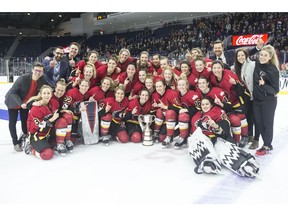 Calgary Inferno players celebrate with the trophy after beating Les Canadiennes de Montreal 5-2 to win the 2019 Clarkson Cup game in Toronto, on Sunday, March 24 , 2019.THE CANADIAN PRESS/Chris Young ORG XMIT: CHY120